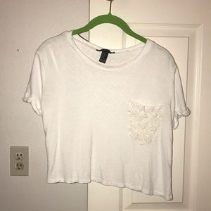 White crop top with lace pocket and cuffed sleeves